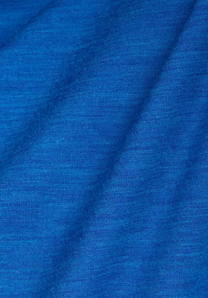 Close-up of Woolx Endurance Tee in Glacial Blue, showing textured Merino wool fabric with diagonal folds.