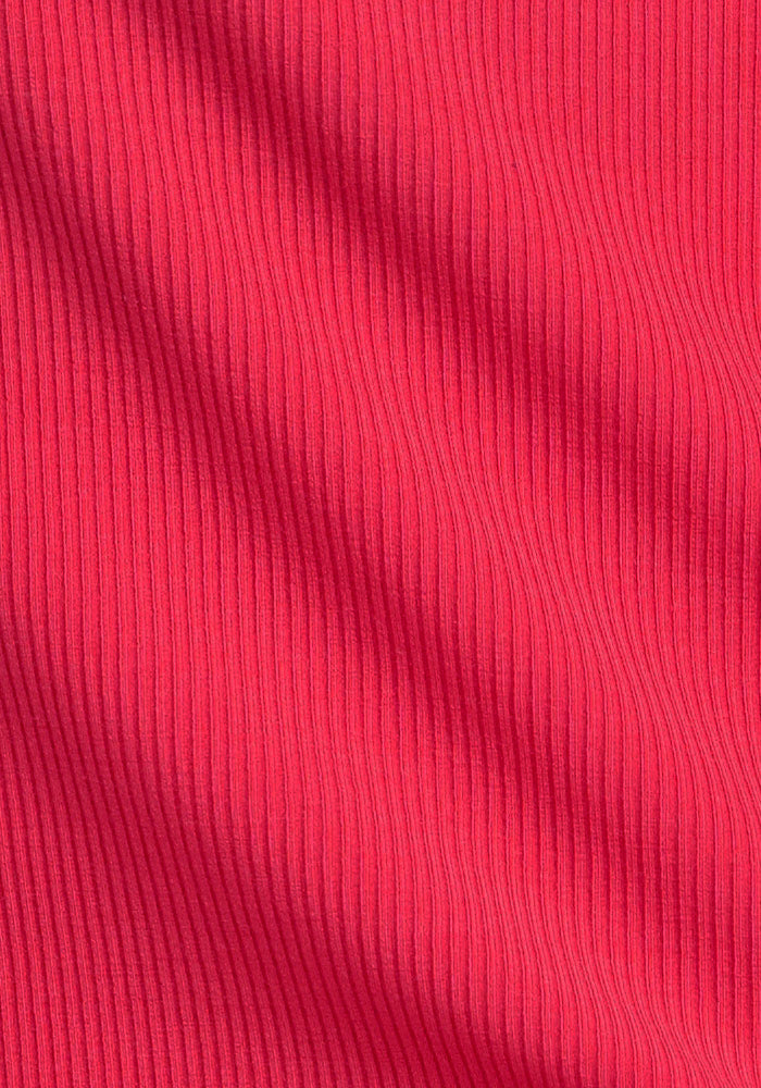 Close-up of Woolx Harlowe Ribbed Dress in Berry Ice Pop, showing vertical textured lines and subtle folds.