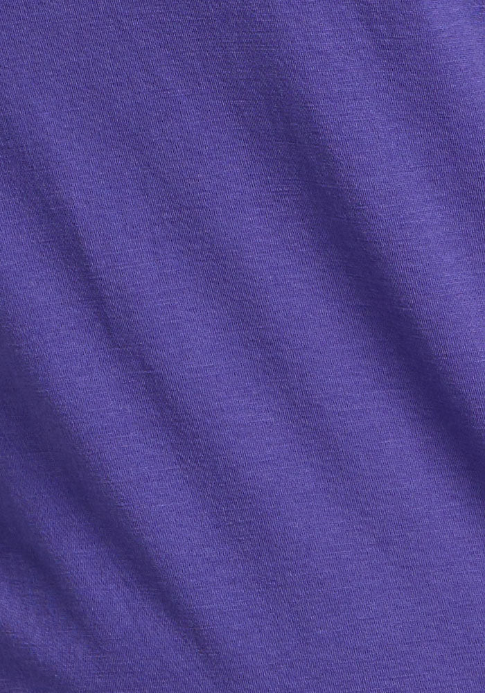 Close-up of the Hazel Tunic - Berry Indigo by Woolx, showing its purple, temperature-regulating knit fabric.