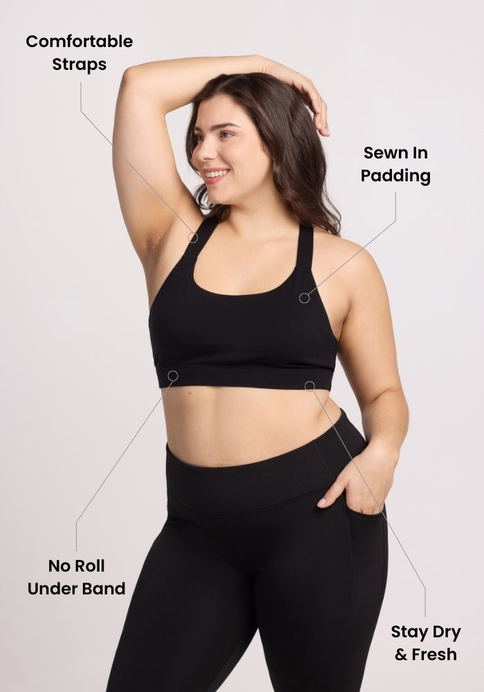 Woman modeling the Woolx Livi Bra • Final Sale - Poppy Spark with comfy straps, sewn-in padding, and stay-dry fabric.