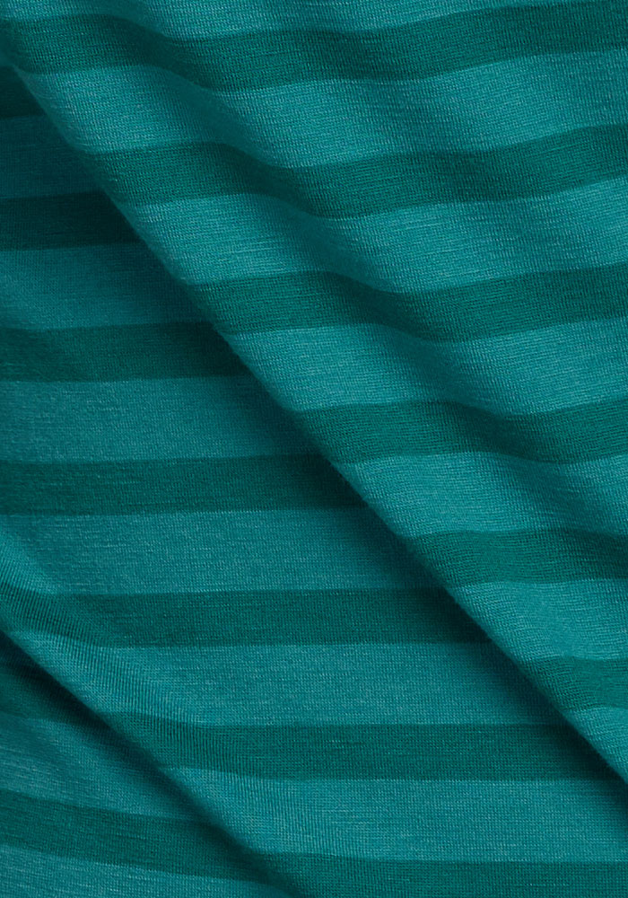 Close-up of the Woolx Liza Crew Neck Tee - Woodland Stripe in teal, featuring dark green stripes and gentle folds.