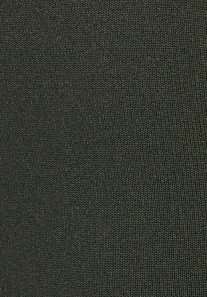 Close-up image of Woolx Merino Flex® McKenna Pocket Leggings - Everleaf, showcasing the dark knit fabric with fine, parallel lines and small loops that highlight the premium athleisure texture.