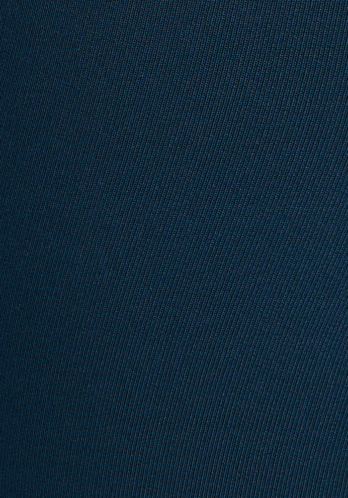Close-up of the dark blue, textured fabric of Woolx Merino Flex® McKenna Pocket Leggings in Majolica Blue, showing fine diagonal lines for a subtle striped look typical of premium merino wool.