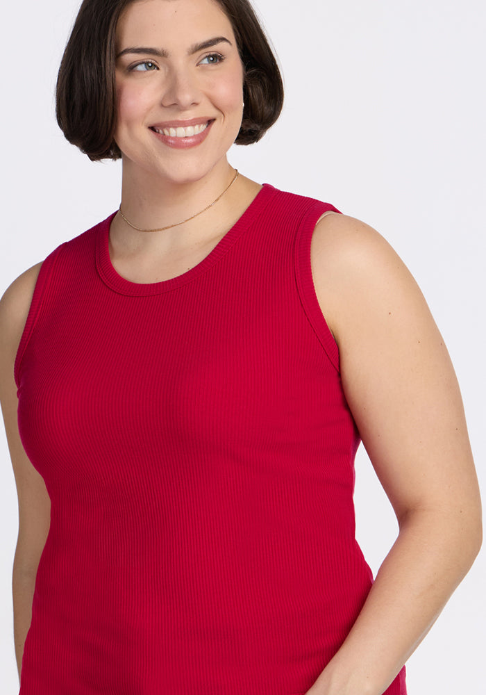 Woman with short brown hair smiles in Woolx Raegan Ribbed Tank Top • Final Sale - Poppy Spark, against a white background.
