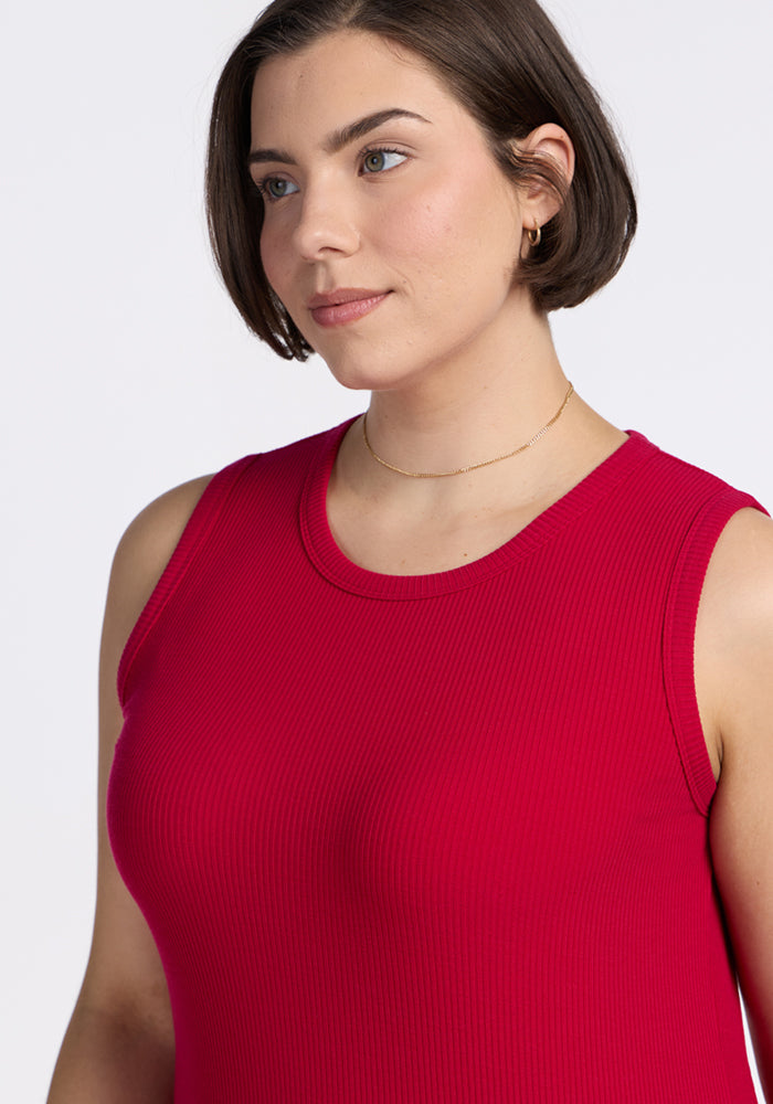 Woman with short brown hair in the Woolx Raegan Ribbed Tank Top in Poppy Spark, against a white background.