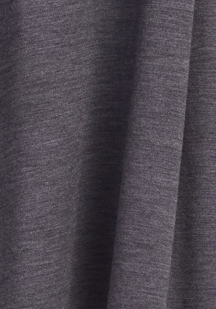Close-up of the Woolx Rissa A Line Dress in Cinder Melange, showing its gray heathered Merino wool fabric—lightweight, smooth, and perfect for fall and winter layering.