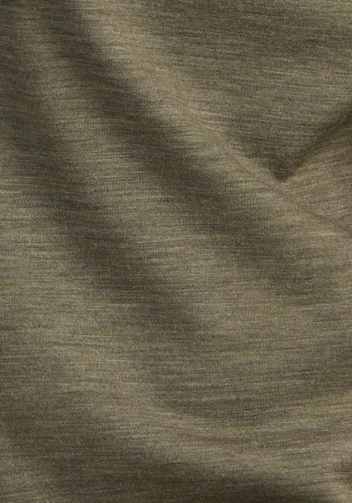 Close-up of Woolx Summit Polo in Sage Olive Melange, featuring a subtle heathered texture for athletic wear.