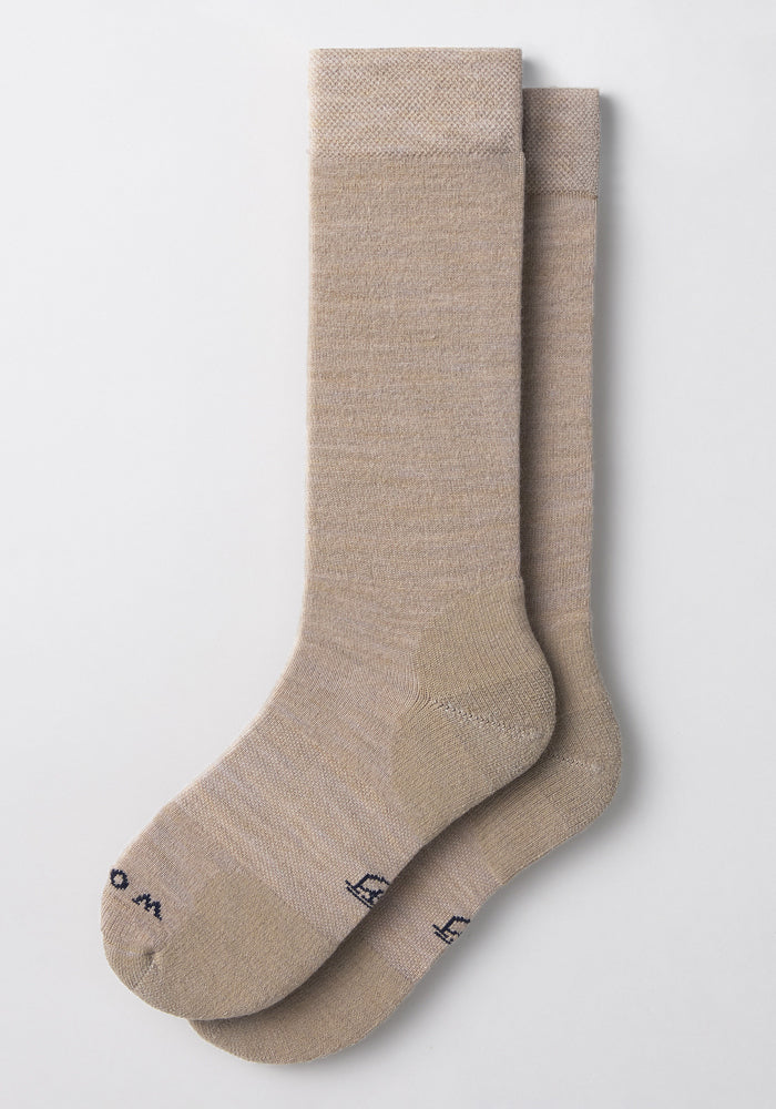 The Woolx Womens Chandler Mid Calf Sock in Simply Taupe is shown laid flat on a white background, featuring lightweight fabric and subtle dark text near the toes.